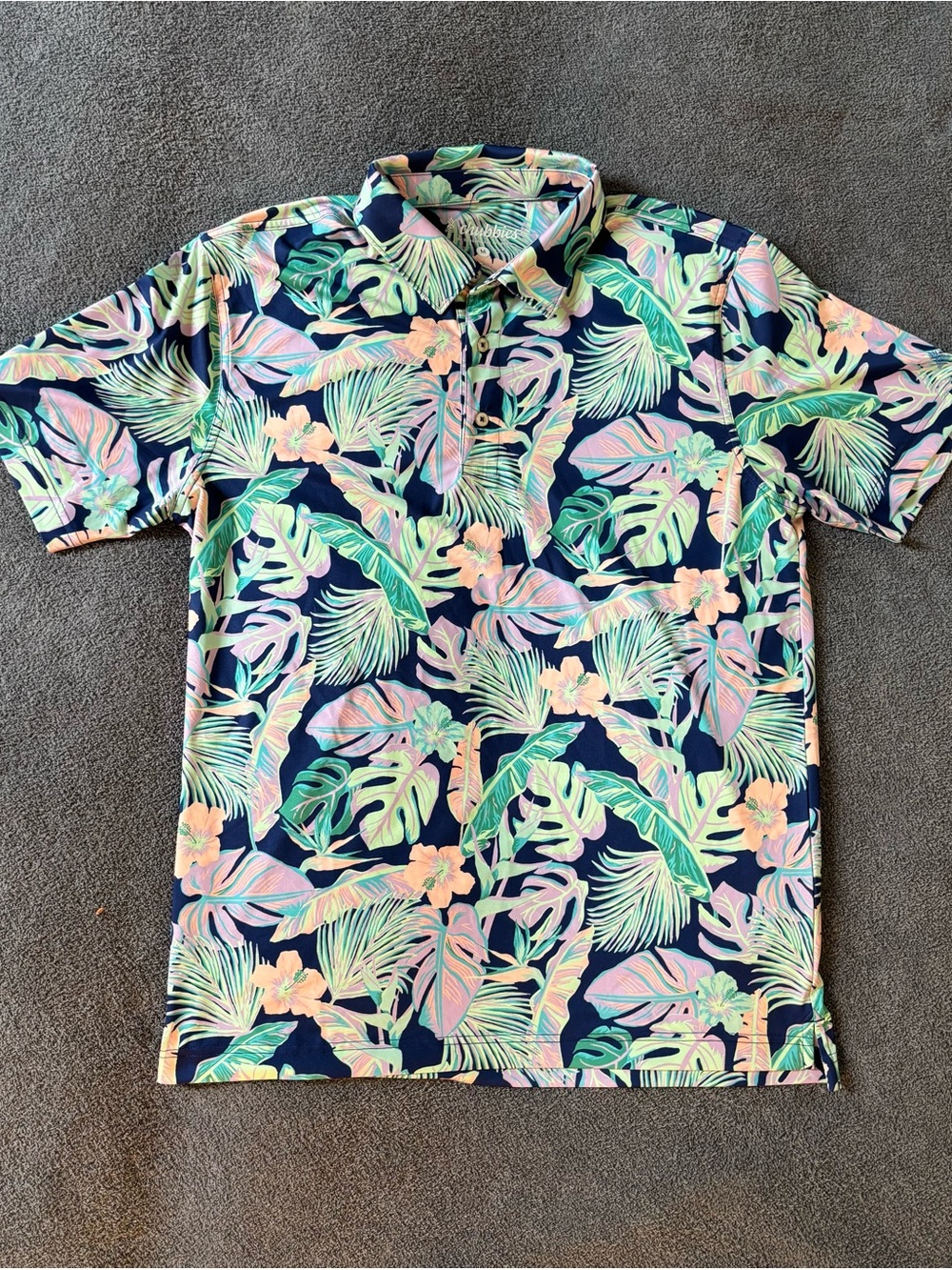 chubbies Navy Tropical Floral Polo with Pastel Accents